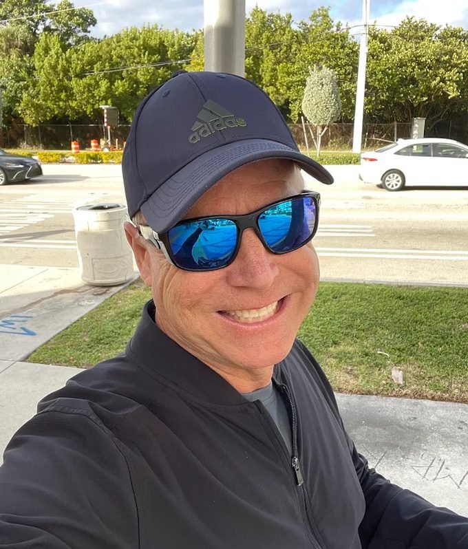 Scott Lingelbach, owner of American Pressure Cleaning, outdoors in a cap and sunglasses.